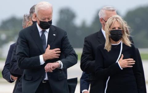 Joe Biden looking at his watch