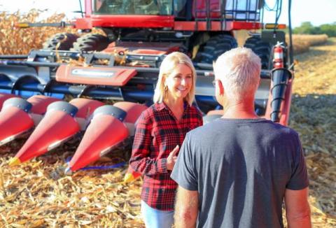 Miller talking to a farmer